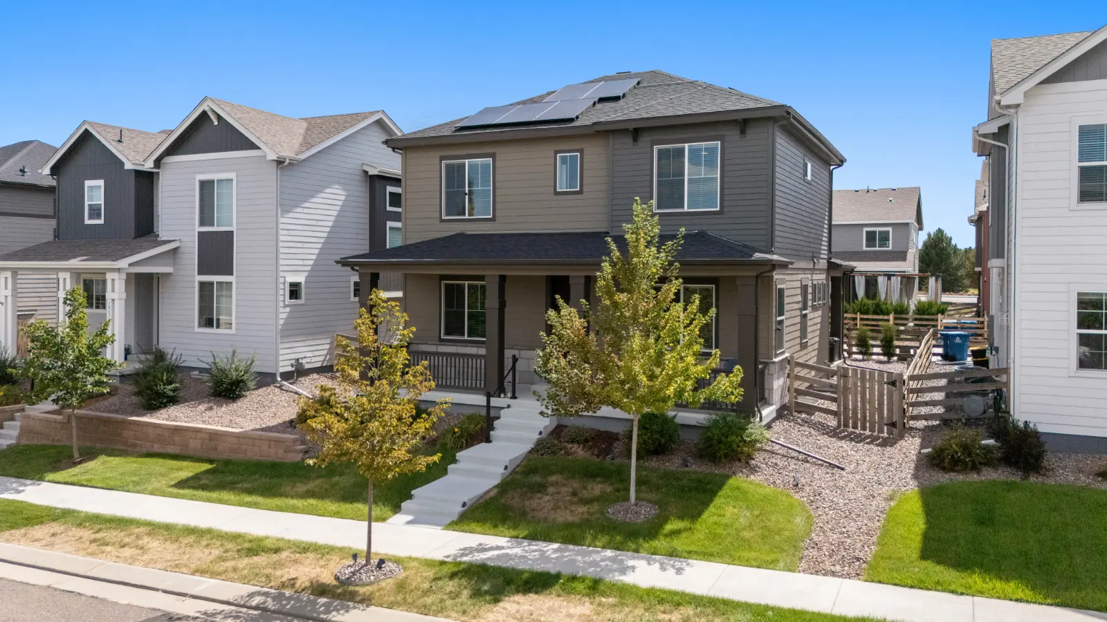 Front yard and porch of 10622 Truckee Street, Commerce City from the sidewalk