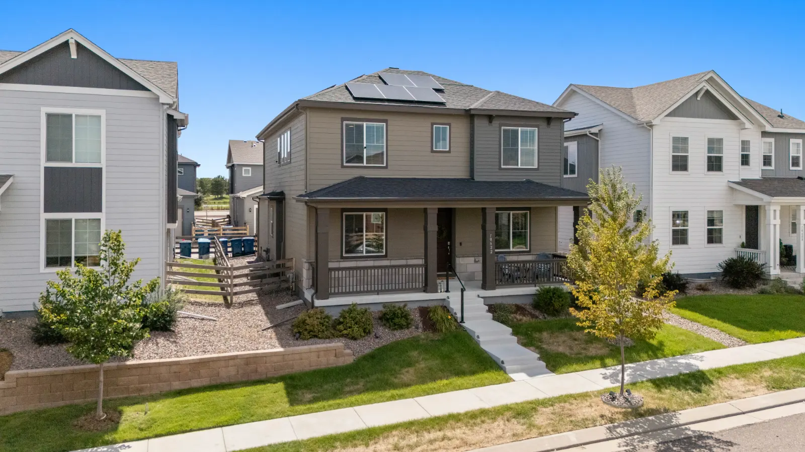 Front exterior of 10622 Truckee Street, Commerce City showing rooftop solar panels