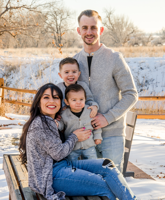 Family walking together in the Colorado Rockies at golden hour